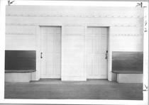 SA0451a - Photo shows two doors, one for Shake sisters and the other for brothers; also, wall benches and pegs. Identified on the back., Winterthur Shaker Photograph and Post Card Collection 1851 to 1921c